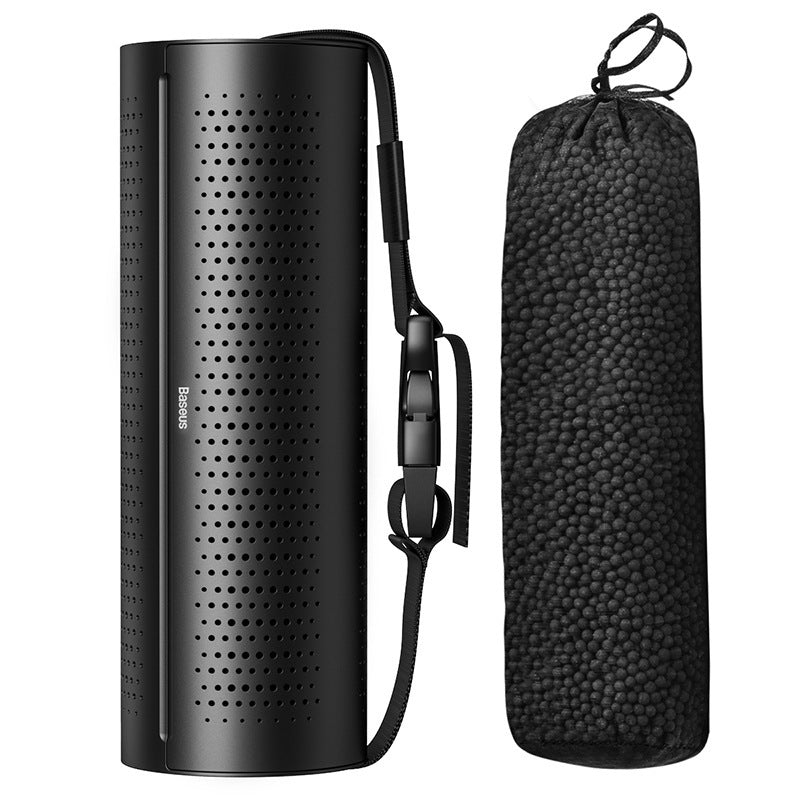 Black portable speaker with carrying strap and case on a white Original Ecological Carbon Package Car Air Purifier background