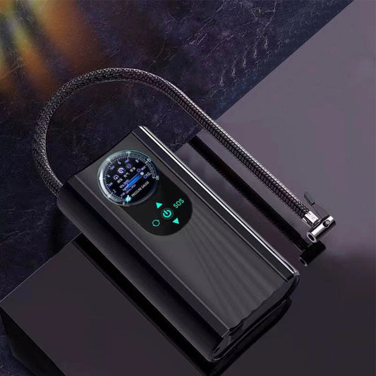 Black electronic device with digital display on a dark surface high-pressure air pump