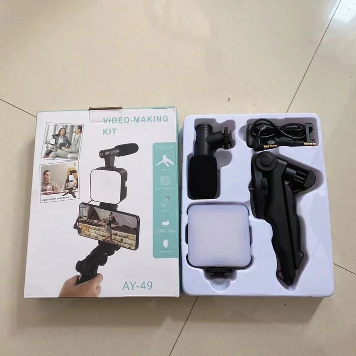 Video-making kit with packaging on a tiled floor