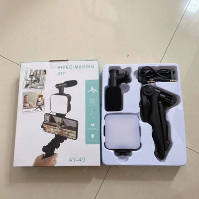 Video-making kit with packaging on a tiled floor