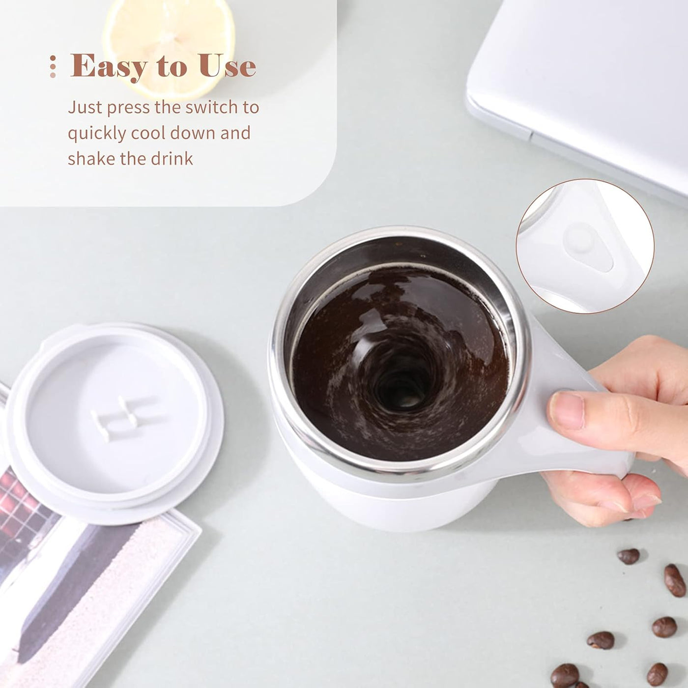 White mug with dark liquid For Kitchen, surrounded by coffee beans on a light gray surface.
