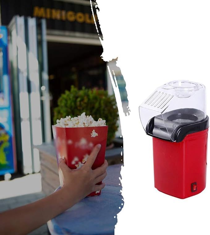 Red popcorn maker with a bowl of popcorn next to a blurred background