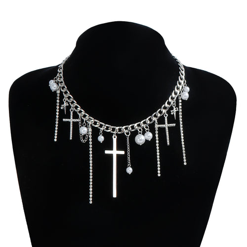 Necklace with cross and pearl pendants on a black mannequin bust.