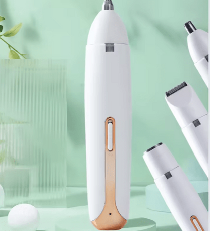 White electronic device with gold accent on a light green background Hair trimmer