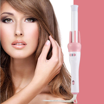 Woman with styled hair and a pink and white hair styling tool on a pink background hair beauty comb brush